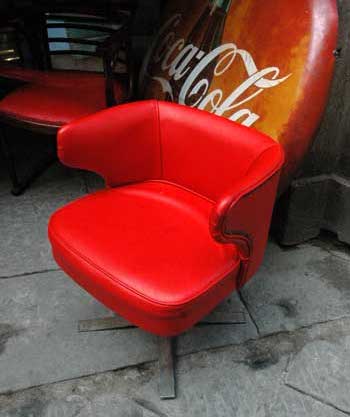 antiquariato: A couple of red leather armchair with iron legs