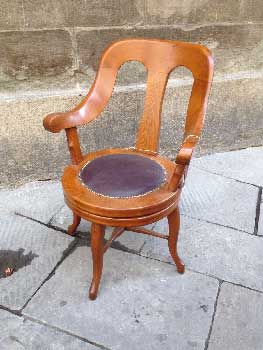swivel chair in wood with leather seat