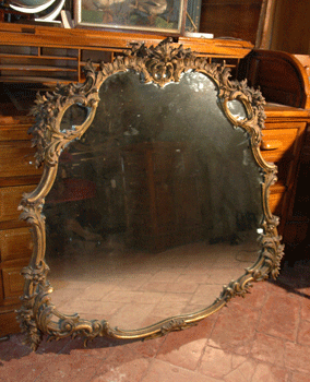 Gold mirror in wood