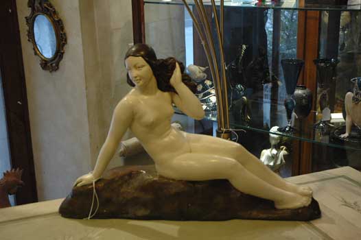 A chalk sculpture, with a woman, signed GORI
